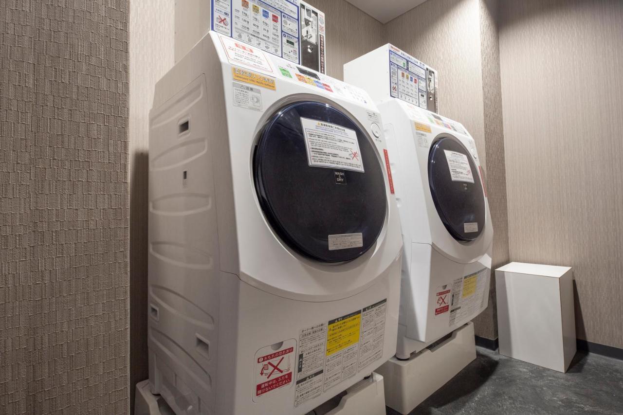 더 로얄 파크 호텔 아이코닉 교토 외부 사진 A washing machine